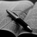 open_bible_with_pen__bw